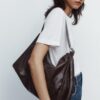 LARGE SOFT BUCKET BAG WITH METAL EYELETS